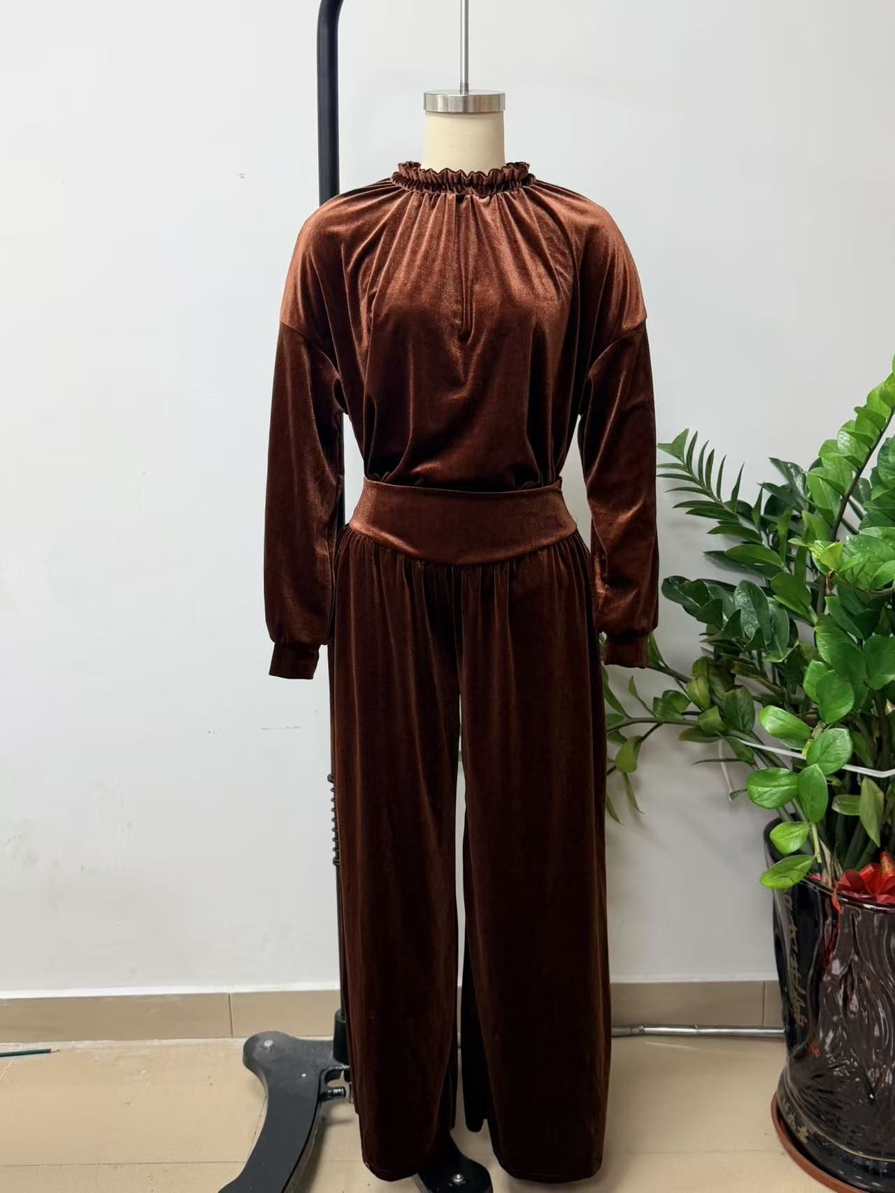 Brown velvet-look gathered-neck top with cuffed sleeves and matching wide-leg trousers displayed on a mannequin